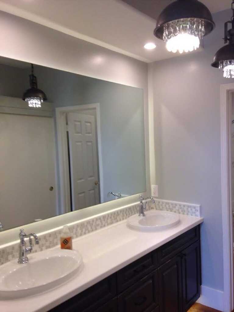 Double-sink bathroom vanity with modern faucets and countertop.
