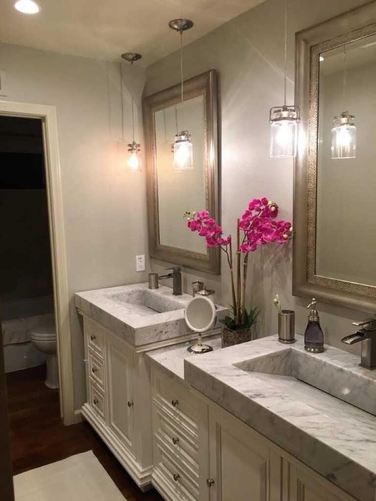 Marble double-sink vanity with modern faucets, full renovation