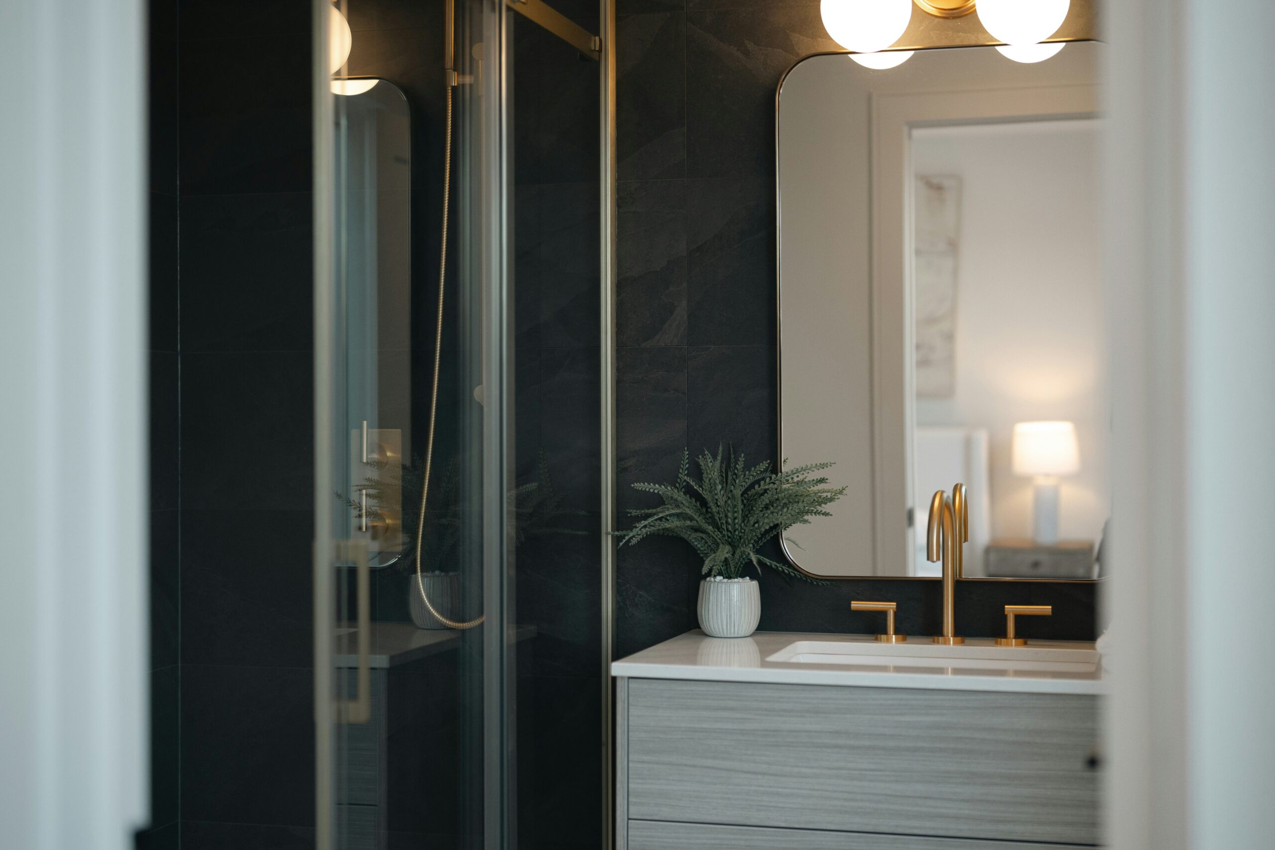 Small, modern bathroom vanity and shower renovation